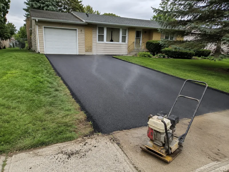Freshly paved asphalt driveway at a Lafayette Indiana home