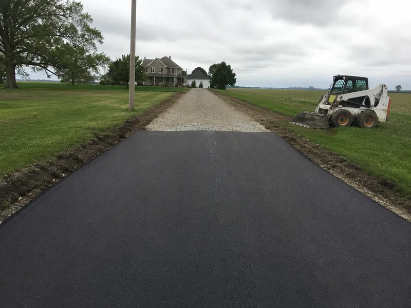 Rural gravel driveway converted to new asphalt near Lafayette Indiana