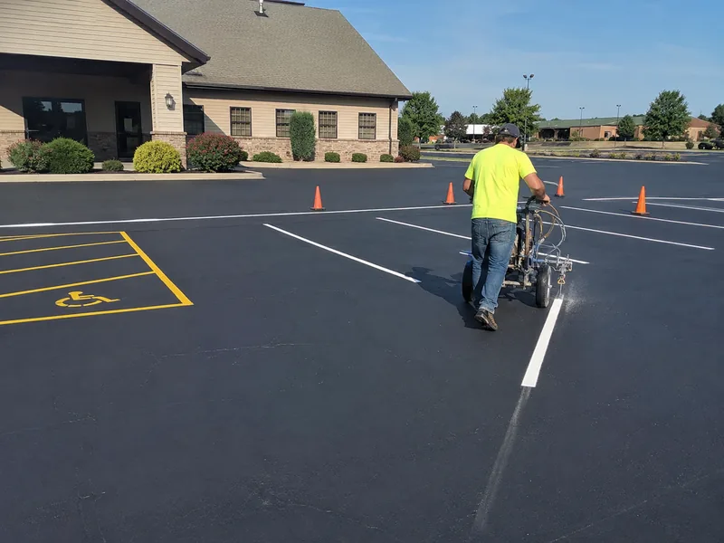 Fresh parking lot line striping on a sealcoated lot in Lafayette